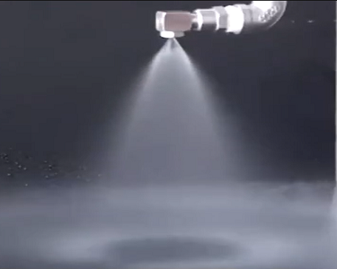 What factors affect the cleaning effectiveness of high pressure atomizing spray systems?